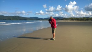 A photographer on Thornton Beach, Daintree Rainforest