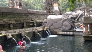 Pura Tirta Empul locals and statue