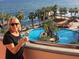 Dreaming about travel: wine on Funchal hotel balcony