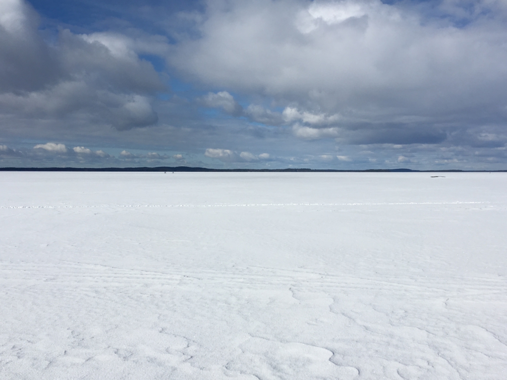 Two skiers on the frozen lake Two skiers on the frozen lake