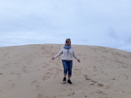 Climbing Rubjerg Knude fyr sand dunes