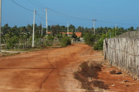 Kalpitiya road and cattle fence Kalpitiya Peninsula gravel road