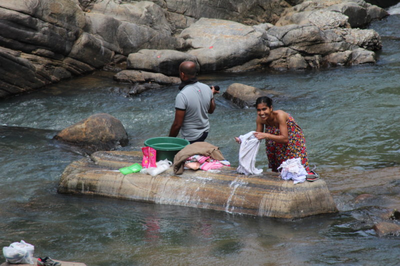 Washing laundry in river Laundry day, Sri Lanka tea country