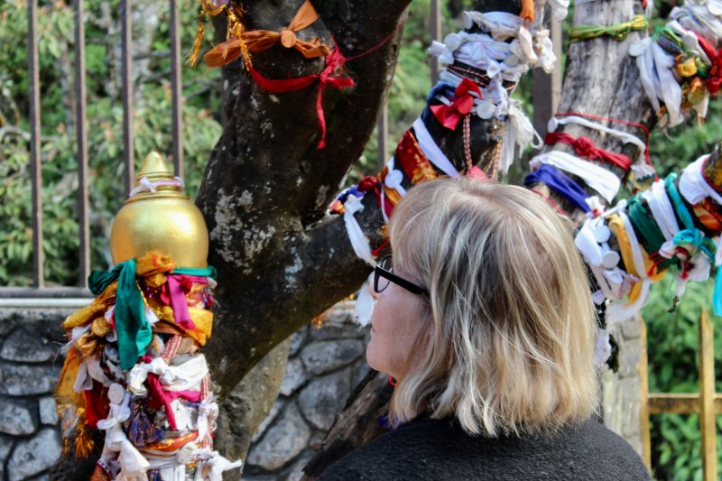 Examining Hindu prayer ribbons Nuwara Eliya sita temple prayer ribbons