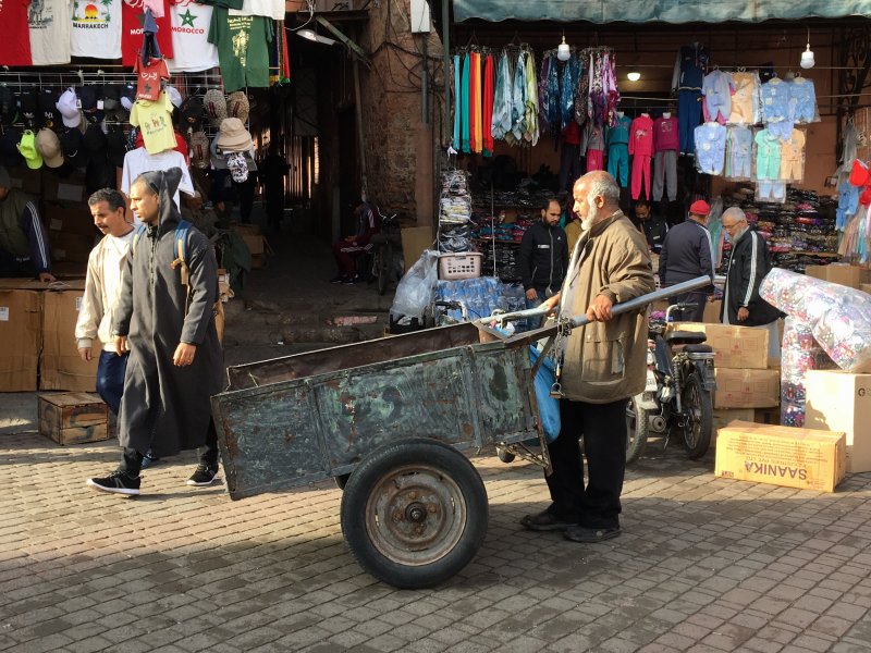 Man and his carriage in the souks of Marrakech