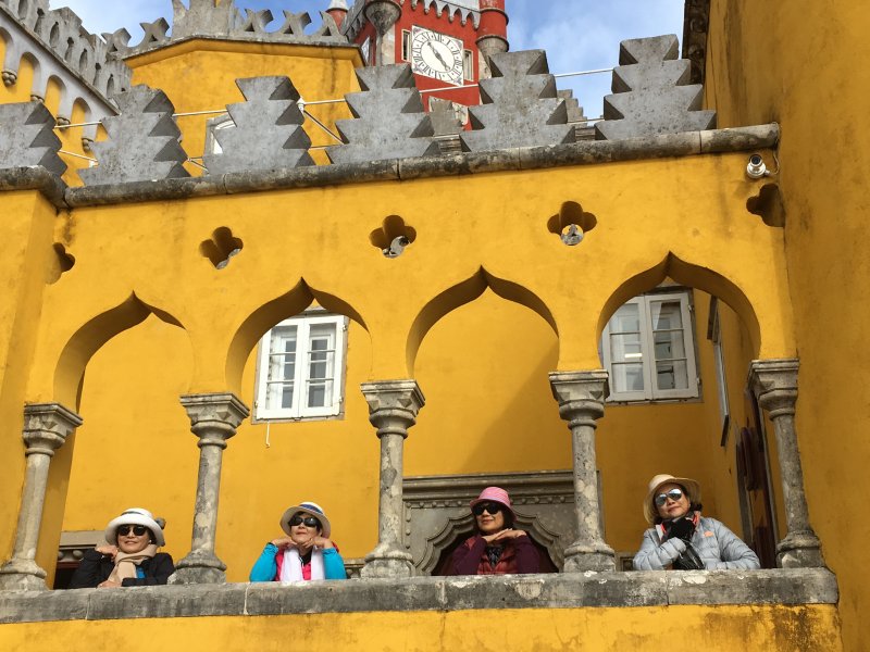 Tourists visiting the palaces of Sintra by bus Visiting the palaces of Sintra by bus