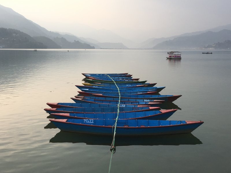 Pokhara: Short Hikes, Lake and the Annapurnas Blue boats on Lake Phewa