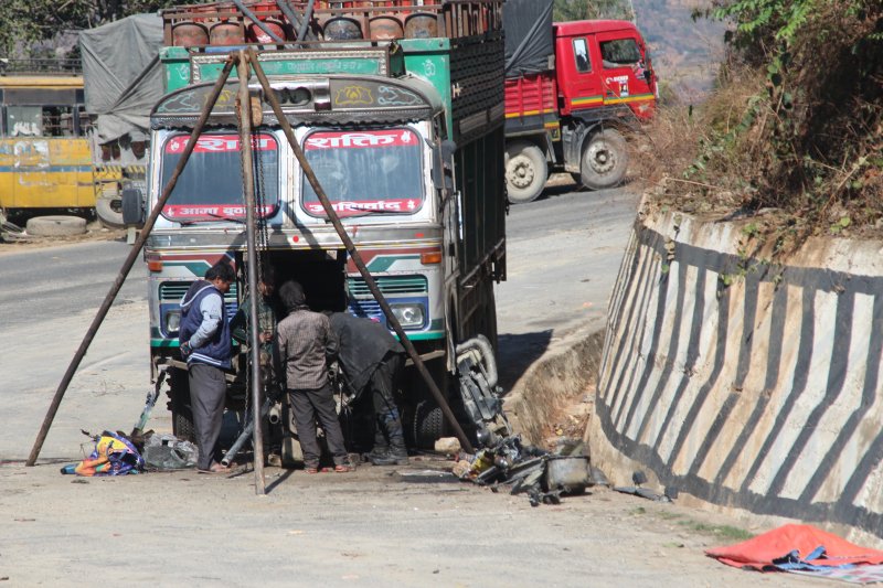 Highway Pokhara to Nepal: repairing a truck Highway traffic Pokhara to Kathmandu