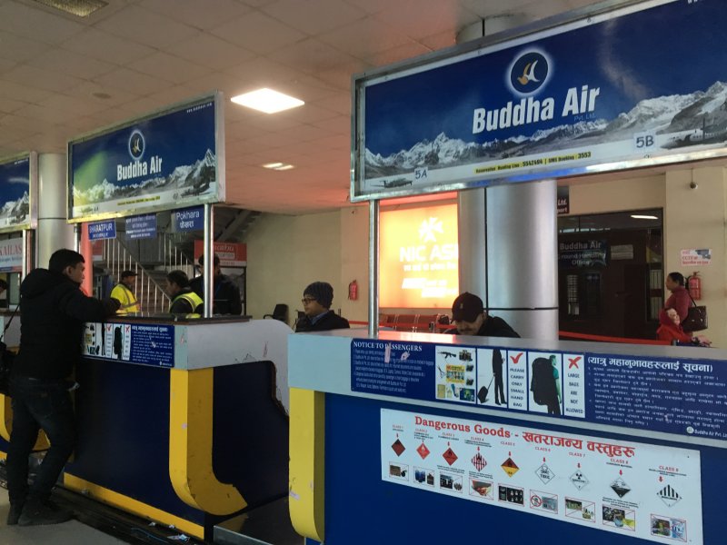 Checking in to our Pokhara flight Kathmandu airport, Nepal