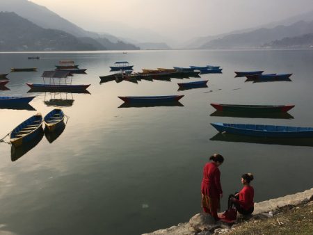 Local women and boats on Lake Phewa