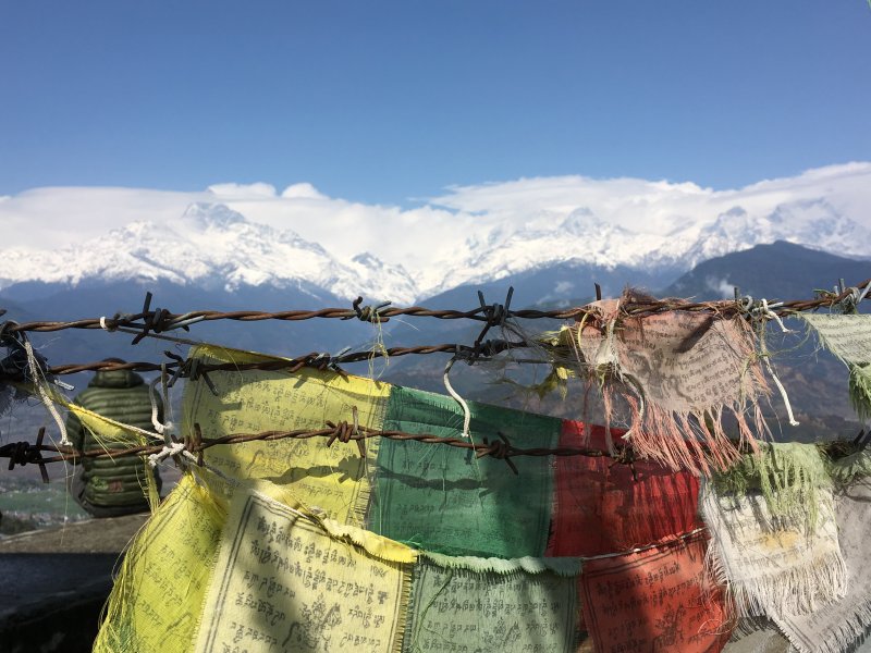 Typical sight in Nepal: mountains and Buddhist flags Prayer flags and Himalayas from Sarangkot
