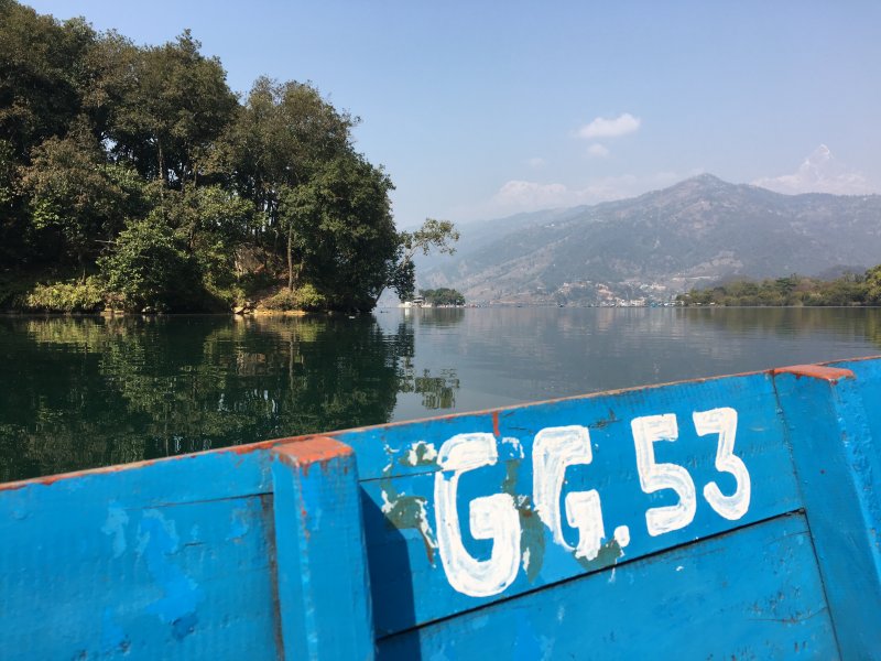 The ores and boats had different numbers Reflections on Lake Phewa, Pokhara