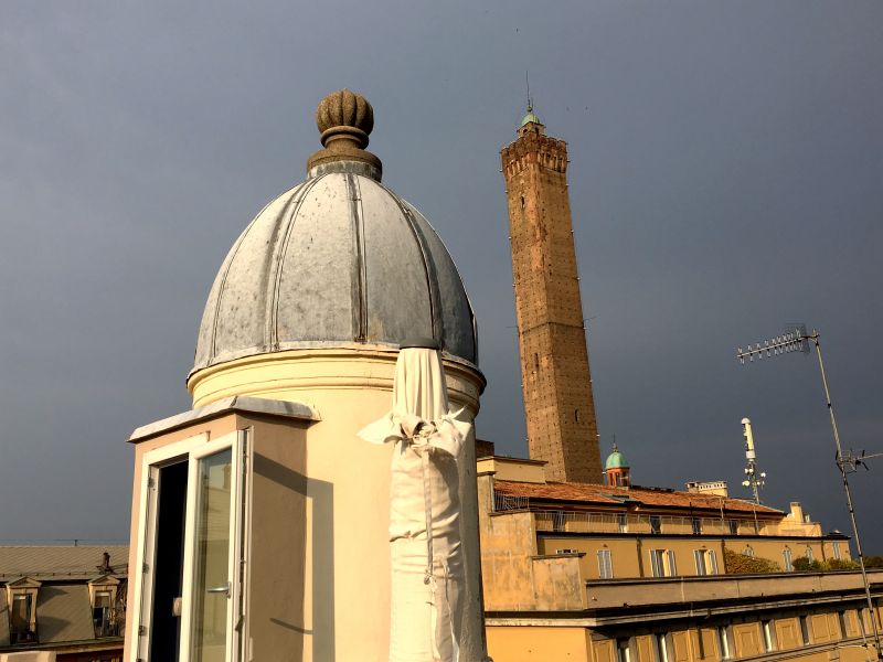 Our roof tower backed by Torre Asinelli Altana Bologna tower and Torre Asinelli