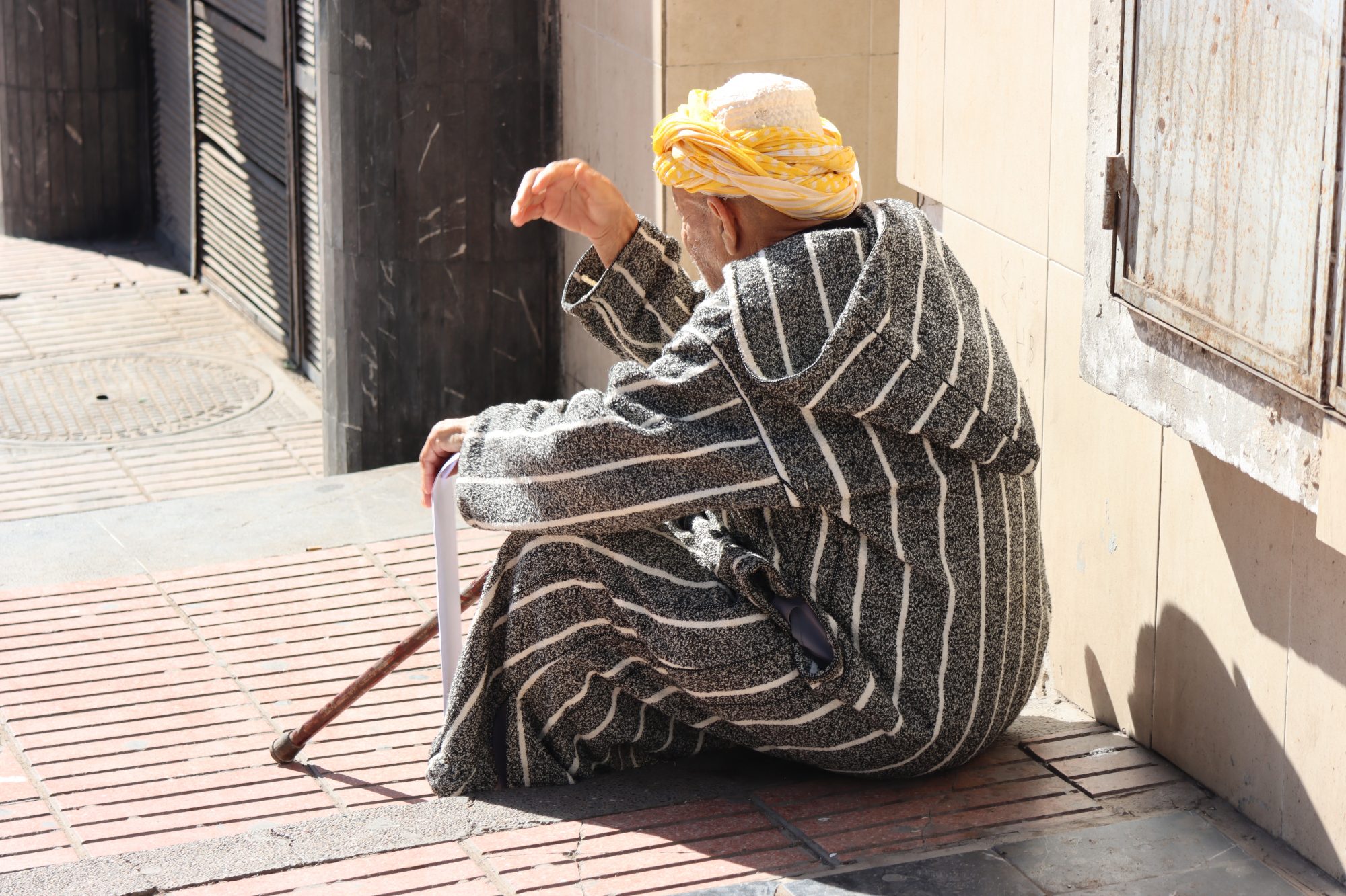 Moroccan Berber man sitting on stairs Moroccan Berber man sitting on stairs