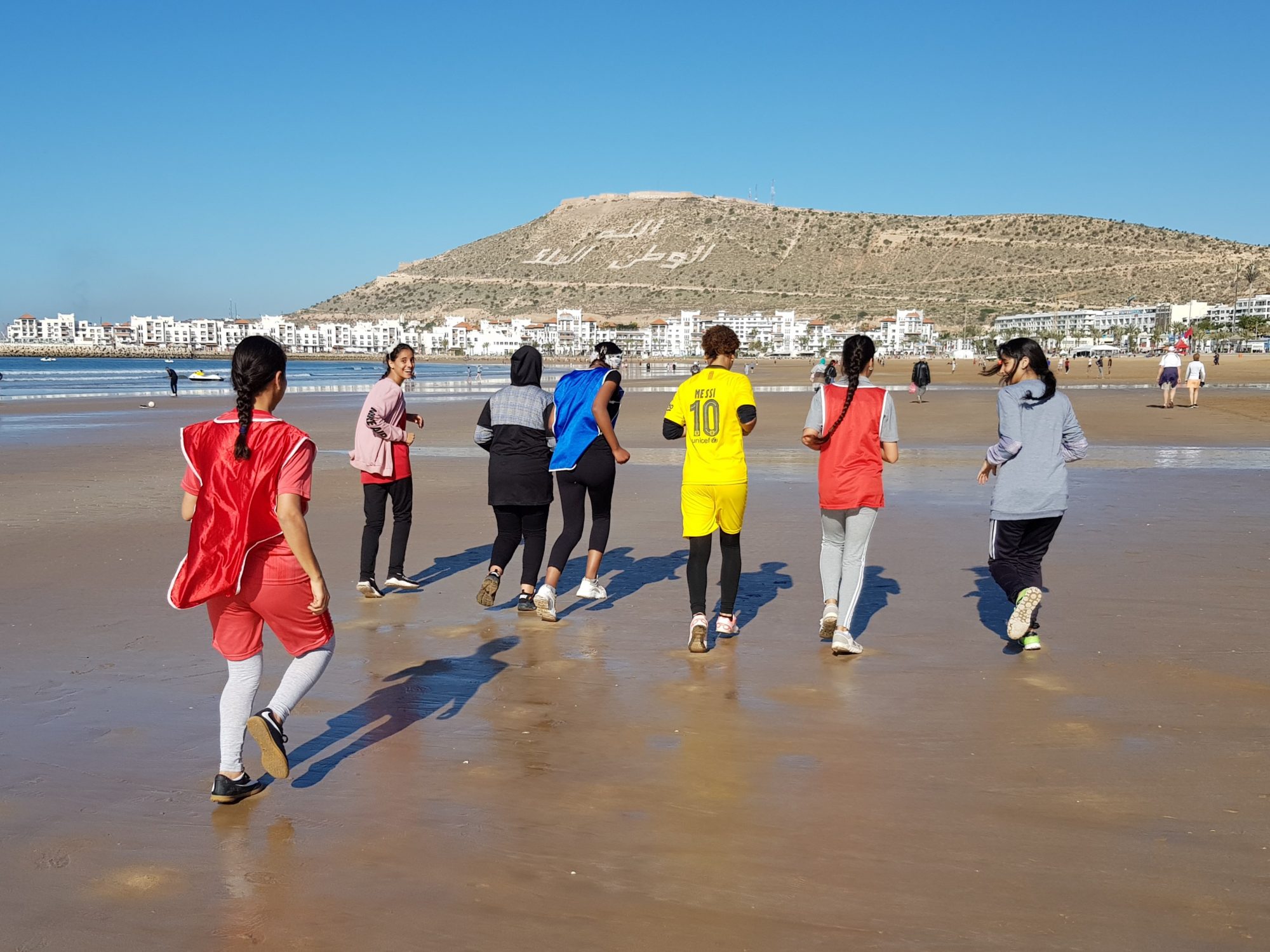 Moroccan girls jogging on Agadir beach Moroccan girls jogging on Agadir beach