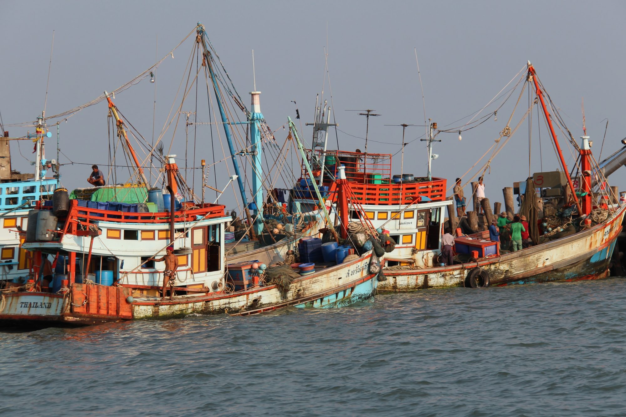 Fishing boats in Ban Phe, fishing village built on poles