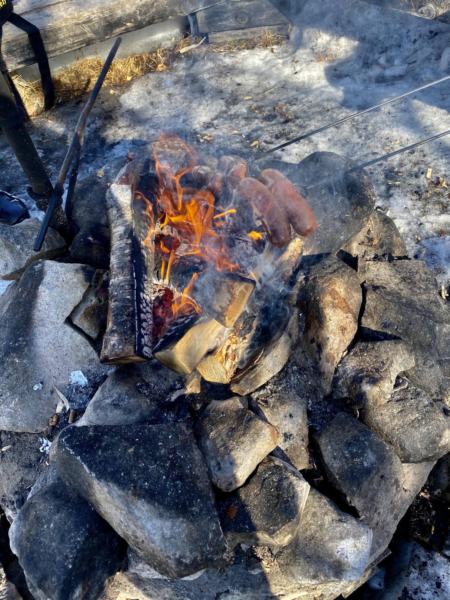 Arctic Lapland spring: sausages on fire