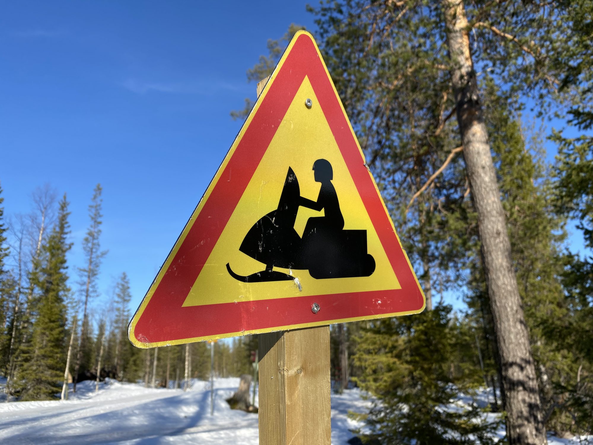 Arctic Lapland spring: snowmobiling in the wild
